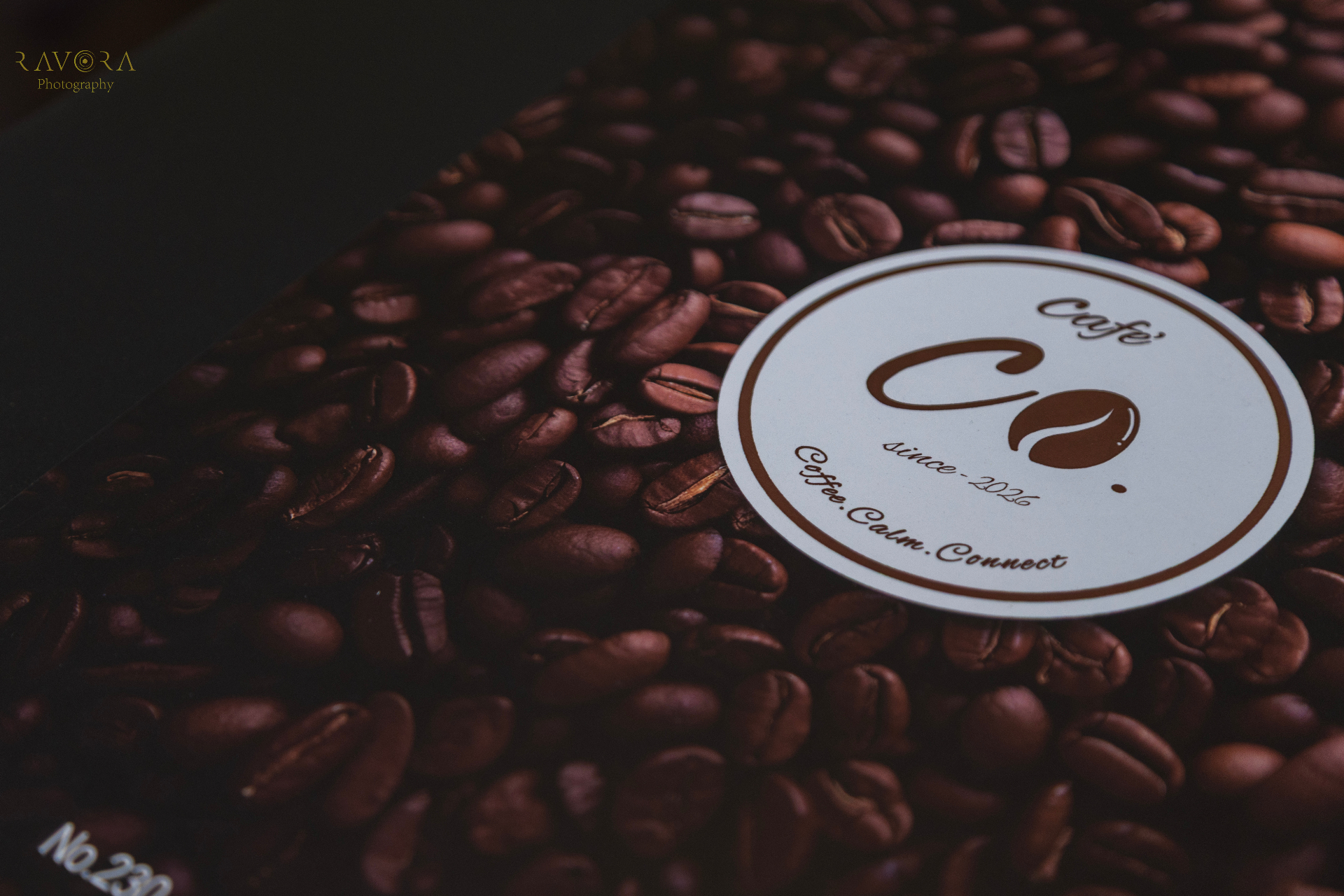 Cafe' Co. logo on freshly roasted coffee beans